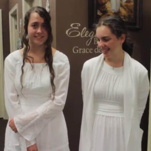 2 young women in lds temple dresses
