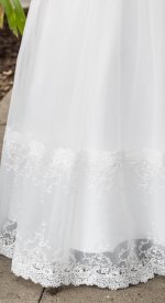Close up of Fairy Godmother baptism gown communion dress all white dress