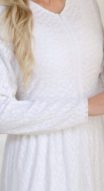 Close-up of New Haven white LDS temple dress with stretch leaf lace, front zipper, and soft textured fabric.