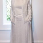 Elegant white lace LDS Temple suit featuring a zip-up jacket with pockets and a flowing A-line skirt